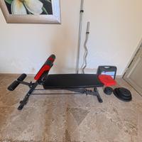 Panca addominali, bilancieri e pesi in ghisa