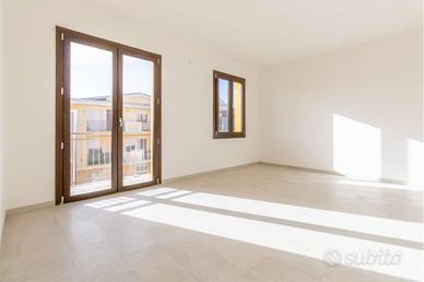 Luminoso quadrilocale con posto auto coperto