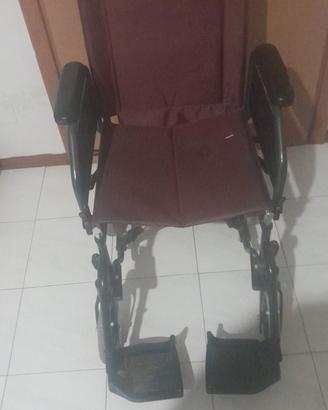 carrozzina-,sedia a rotelle 