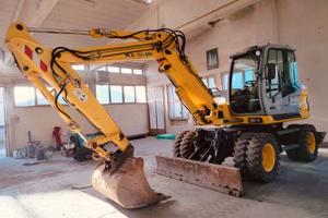 escavatore gommato 125 ql NEW HOLLAND MH 3.6