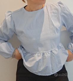 camicia a righe con fiocchi aperta dietro