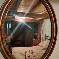 specchio cornice ovale Lavorata  oro antico