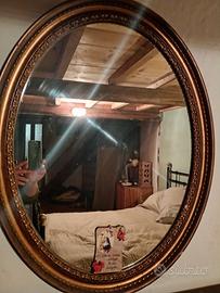 specchio cornice ovale Lavorata  oro antico