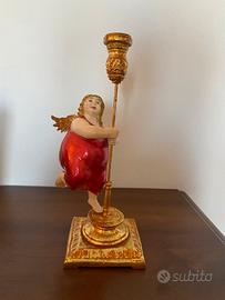 Candeliere con putto