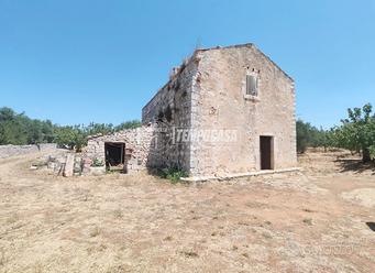 Deposito con terreno di pertinenza