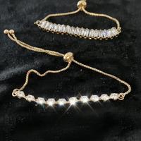 Coppia braccialetti acciaio dorato e cristalli