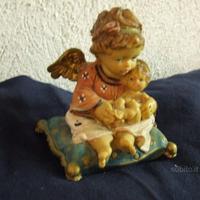 Putto angelo con bambino dipinto a mano