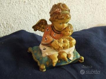 Putto angelo con bambino dipinto a mano