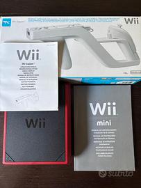 Wii mini rossa + joystick + Wii zapper + giochi