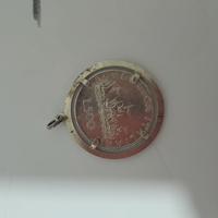 ciondolo con moneta d'argento 