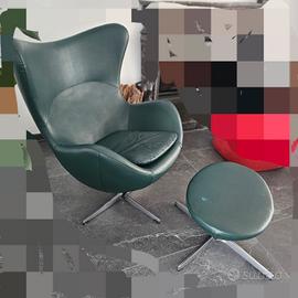 poltrona girevole con poggiapiedi