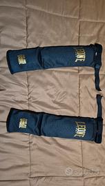 Paratibie Leone misura L 2025 - come nuove 