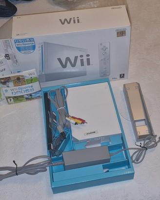 Wii con telecomandi e Wii board + 3 giochi base