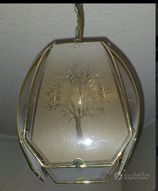 Lampadario in vetro con disegno albero.