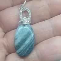 Set artigianale orecchini e collana in acciaio