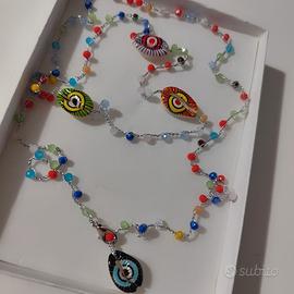 collana lunga conchiglie occhio di bue .