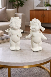 Coppia Sculture Putti in Porcellana Bianca