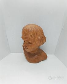Testa in legno, scultura a mezzo busto. L'oggetto