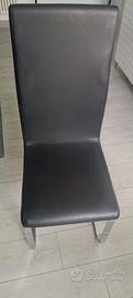 4 sedie nere tenute benissimo in finta pelle 