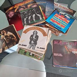 3 lp in vinile e 50 circa 45 giri