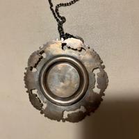 Medaglione capoculla in argento 800