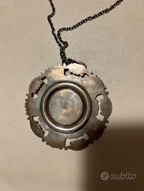 Medaglione capoculla in argento 800