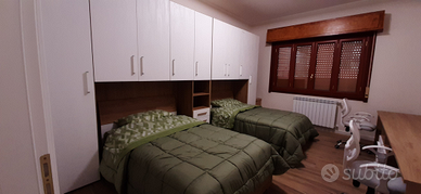 Camera/posti letto in appartamento