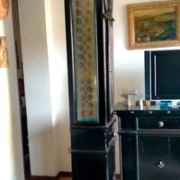 Antica colonna porta pendolo