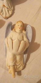 Due acquasantiere vintage a forma di angelo