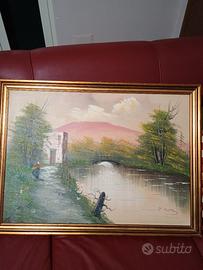 Quadro completo di cornice dorata.