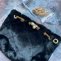 Borsetta in pelo sintetico nera nuova