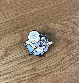 Spilla Olimpiadi 2026