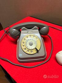 Telefono Italtel grigio a disco