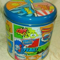 Scatola rotonda in latta con fumetti.