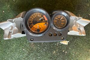 Raro- quadro strumenti + copri manubrio originale