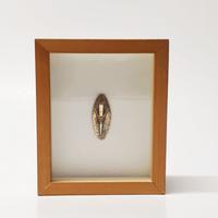 Arnaldo Pomodoro rilievo astratto in teca