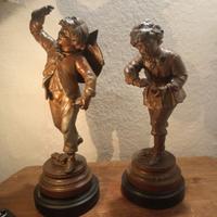 Coppia di statue in antimonio patinato