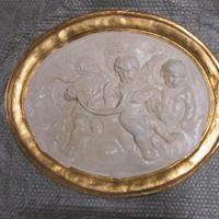 Bassorilievo ovale in gesso "Putti"