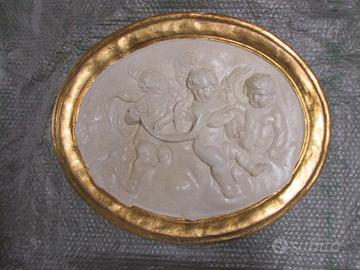Bassorilievo ovale in gesso "Putti"