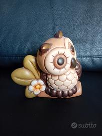 thun civetta su ramo con fiore 