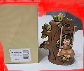 Bimba sull’ altalena Thun nature