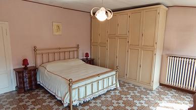 Camera da letto matrimoniale in stle