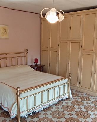 Camera da letto matrimoniale in stle