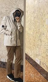 Giacca stile C.P. Company, colore beige/panna.