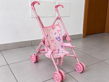 Piccolo passeggino per bambole rosa richiudibile