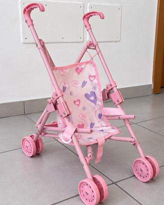 Piccolo passeggino per bambole rosa richiudibile