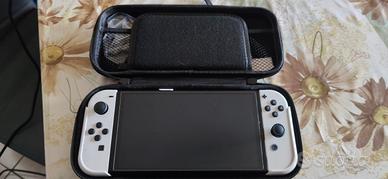 Nintendo Switch+4 giochi+Grips Skull&Co.