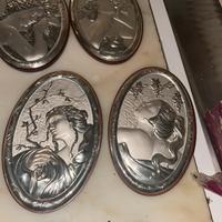 Quadretti in argento raffiguranti le quattro stag