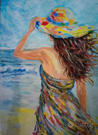 DONNA BRUNA CHE TRATTIENE IL CAPPELLO