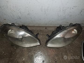 fari anteriori  e griglia lancia y 08